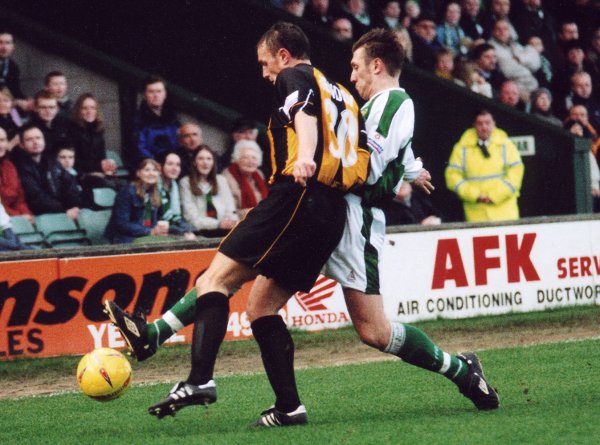 Kirk Jackson goes in for the tackle with Barnet's Ian Hendon