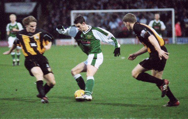 Michael McIndoe gets closed down by two Barnet players