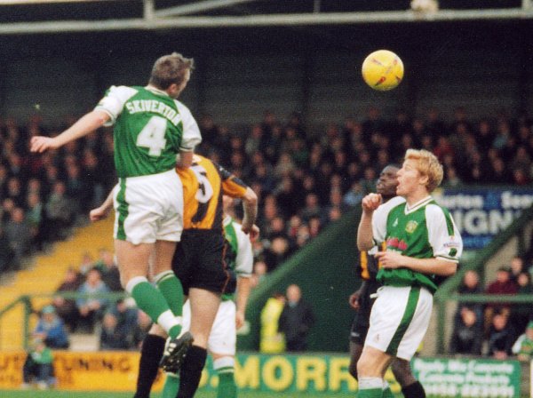 Terry Skiverton gets in a first half header with Adam Lockwood looking on