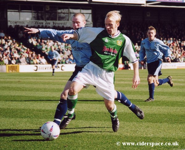 Darren Way shields the ball from a Burscough defender