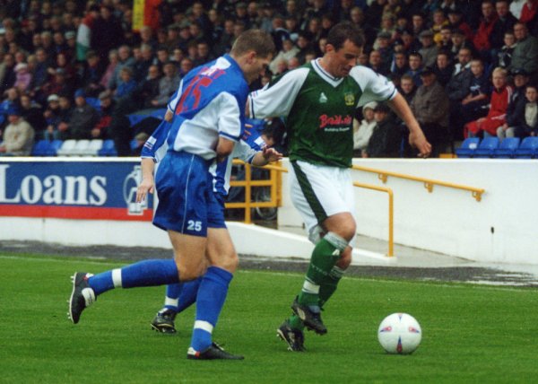 Howard Forinton battles with former Southport defender Scott Guyett