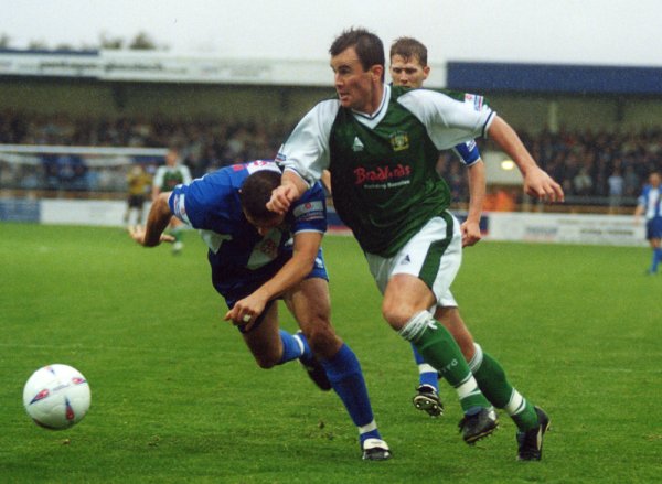 Howard Forinton powers his way into the Chester penalty area