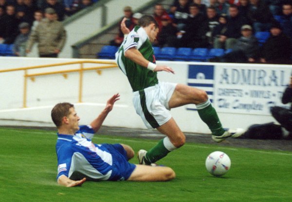 Michael McIndoe gets on the end of a sliding tackle from a Chester defender
