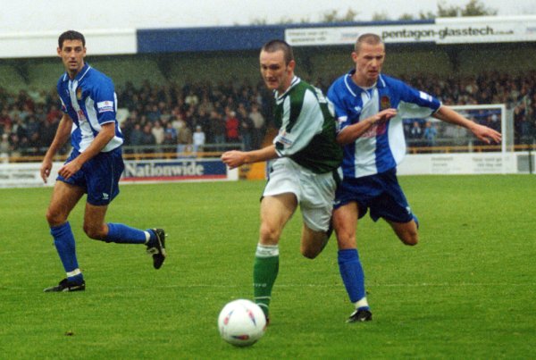 Gavin Williams forces his way past a Chester midfielder