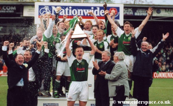 Yes! Terry Skiverton lifts the Conference trophy!