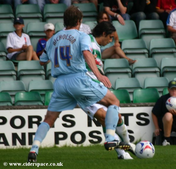 Luciano Alvarez shields the ball from Chesterfield's Shane Nicholson