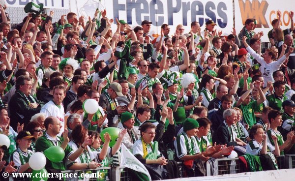 The crowd greet the players as they come out for the warm-ups