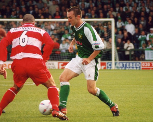 Gavin Williams battles with Doncaster central defender Mark Albrighton