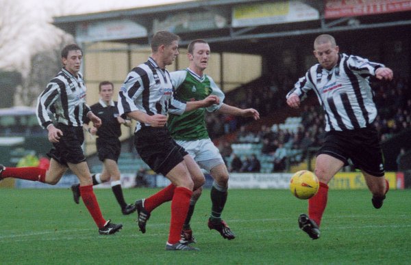 Gavin Williams loses out on possession to a Forest Green defender