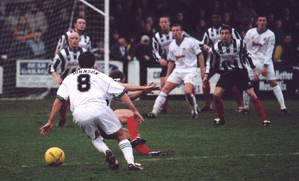 Lee Johnson weaves into the penalty box with Terry Skiverton and Kirk Jackson hoping to receive the ball