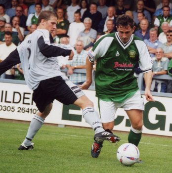 Nick Crittenden makes a left wing run but is tripped by a Gravesend defender