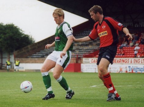 Terry Skiverton shields the ball from a Kettering defender