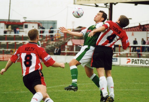 Howard Forinton attempts to control the ball under pressure from Neil Durkin
