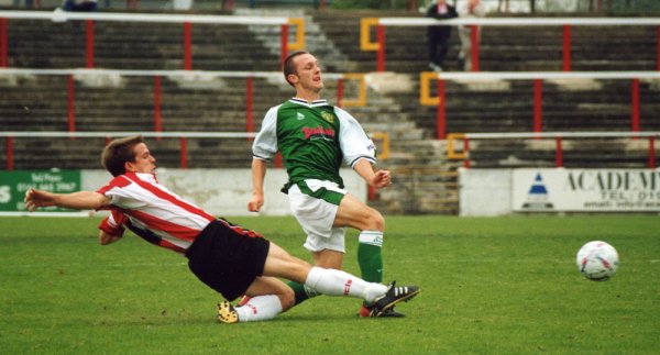 Gavin Williams finds a run halted by a sliding tackle