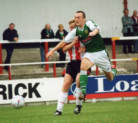 Penalty! Gavin Williams gets barged off the ball by a Leigh defender
