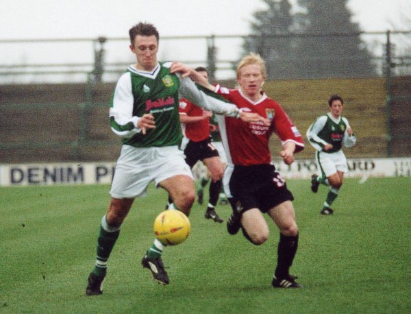 Kirk Jackson edges away from Morecambe's David Perkins