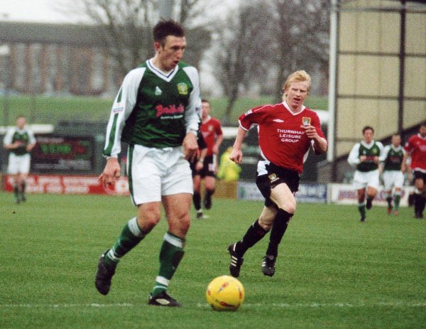 Kirk Jackson wins another battle with Morecambe's David Perkins