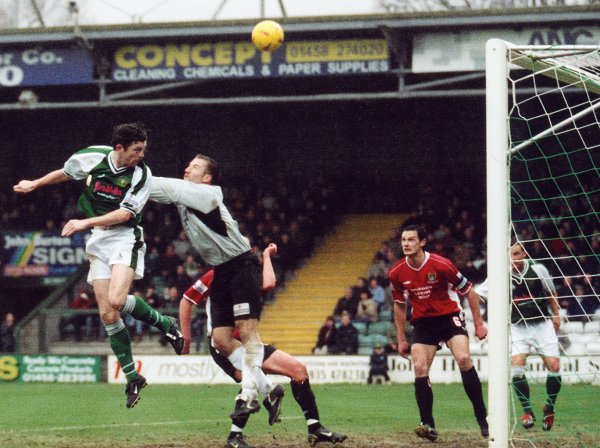 Roy O'Brien has his flying header deflected over the bar by Morecambe keeper Craig Mawson
