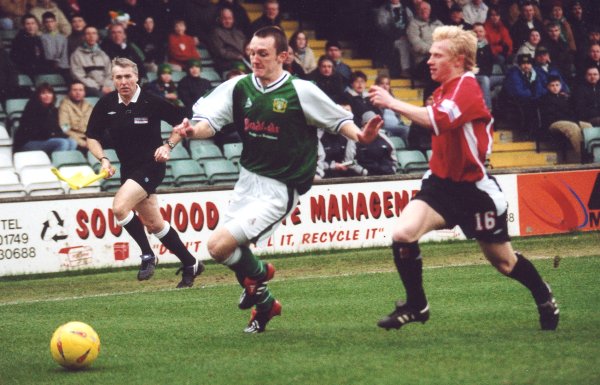 Gavin Williams gets the better of Morecambe's David Perkins