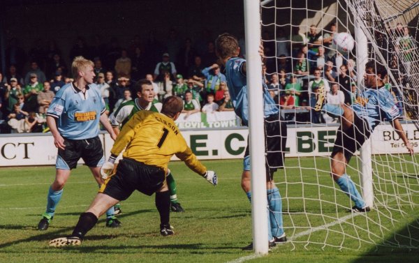 A Vics defender tries in vain to stop Kim Grant's header from crossing the line for Yeovil's second goal