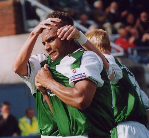 Kim Grant is congratulated on his goal