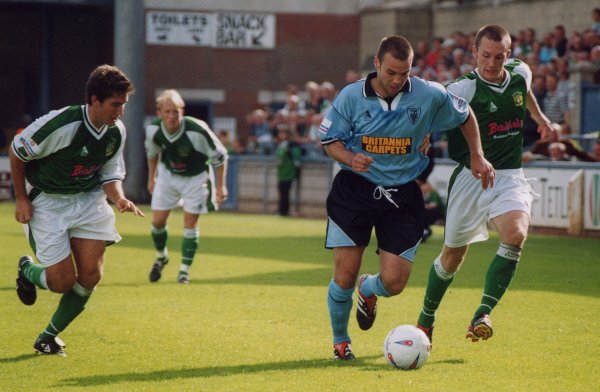 Gavin Williams and Lee Johnson chase a Vics midfielder
