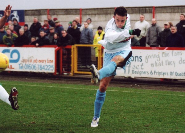 Goal! Macca lets fly from an acute angle, opening the scoring for the Glovers