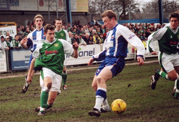Nick Crittenden threads the ball past a Nuneaton player into the path of Lee Johnson