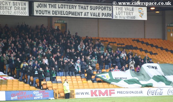 The travelling support rise as the teams come out