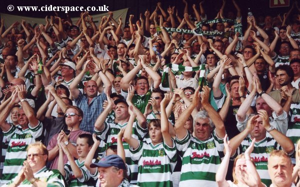 More of the crowd greeting the players onto the pitch