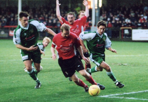 Lee Johnson and Kirk Jackson attempt to close down a Scarborough defender