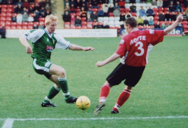 Adam Lockwood battles for the ball with Scarborough's Mark Hotte