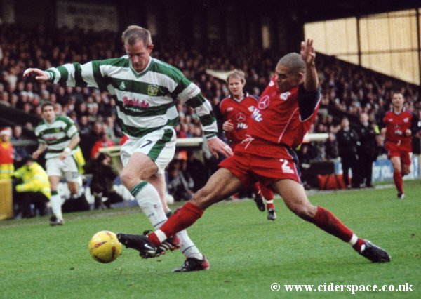 Jake Edwards comes under pressure from Scunthorpe's Nathan Stanton