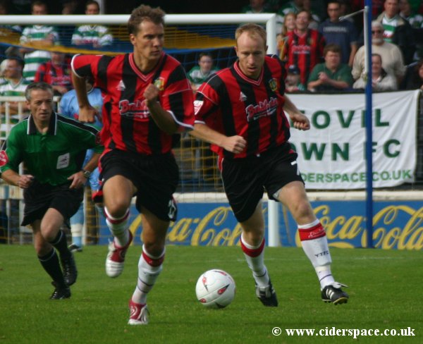 Paul Terry moves up field supported by Bartosz Tarachulski