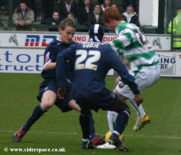 Matt Harrold finds Southend's Efetobore Sodje closing him down