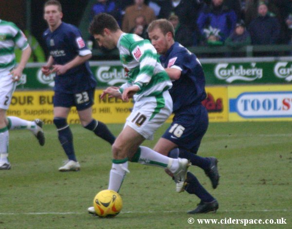 Phil Jevons holds off Southend's Luke Guttridge
