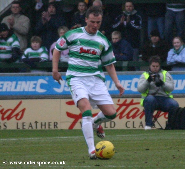 Colin Miles brings the ball out of defence