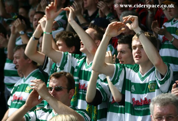 The away supporters start to get into good voice