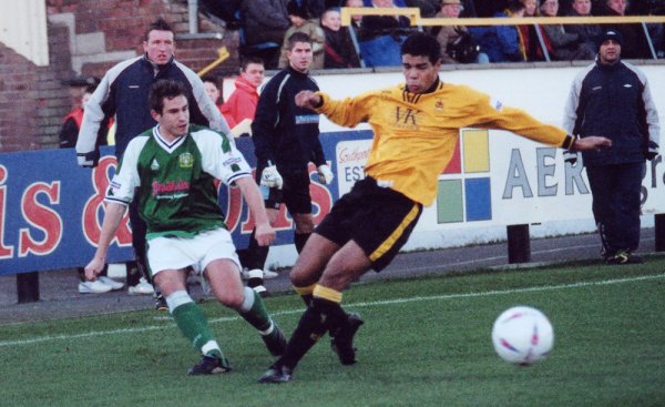 Nick Crittenden gets in a right wing cross under pressure