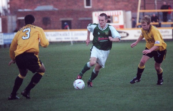 Gavin Williams attacks with Southport's Dean Howells looking on