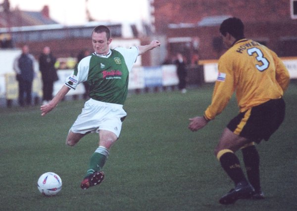 Gavin Williams gets in a cross despite the attentions of Dean Howell