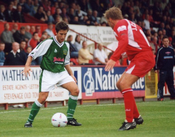 Lee Johnson attempts to work his way past a Stevenage defender