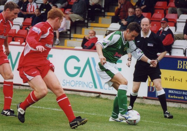 Michael McIndoe tries to keep the ball in play down the left wing