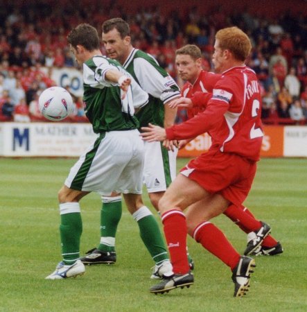 Michael McIndoe and Howard Forinton work their way through the midfield