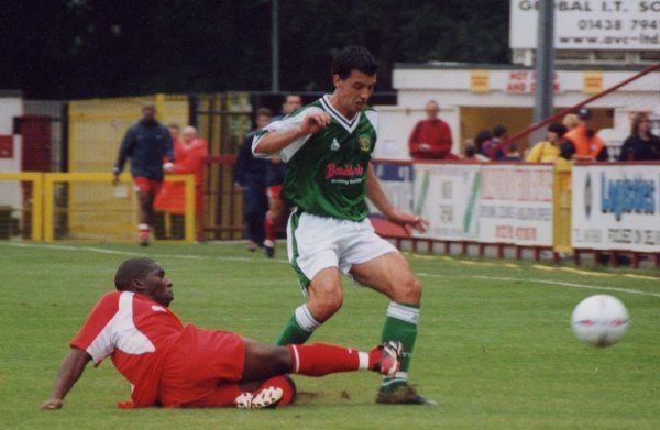 Anthony Tonkin finds himself closed down by a Stevenage midfielder