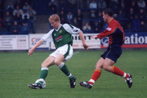 Adam Lockwood shields the ball as he makes a forward run into midfield