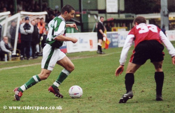 Abdelhalim El Kholti gets a watchful eye from Woking's Jon Coates