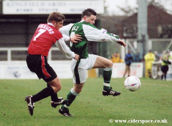 Kevin Gall shields the ball from Woking's Ben Townsend