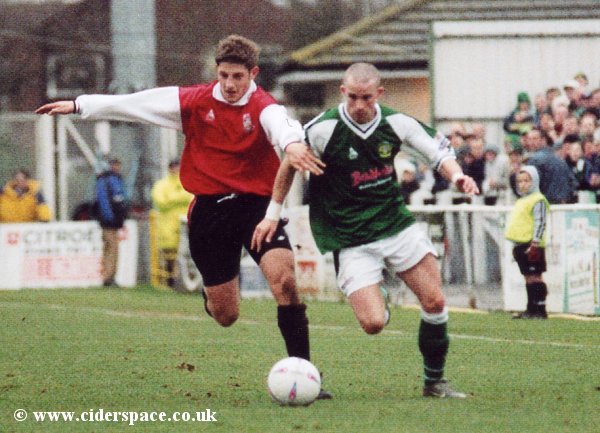 Michael McIndoe cuts inside a Woking defender