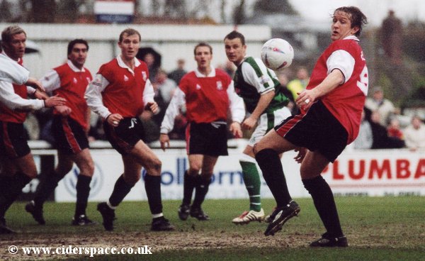Former Glover Warren Patmore looks to control a bouncing ball, with only Colin Pluck in view for the greens